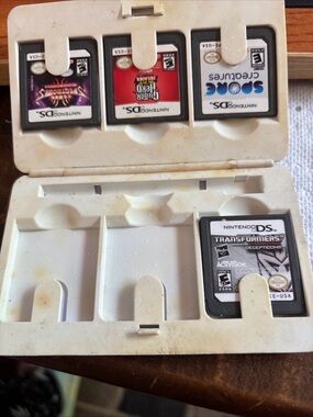 Nintendo DS lot of 4 games-transformers, spore creatures, guitar hero, spectrobe